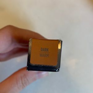 UD All Nighter waterproof full-coverage concealer. 

Shade: Dark warm